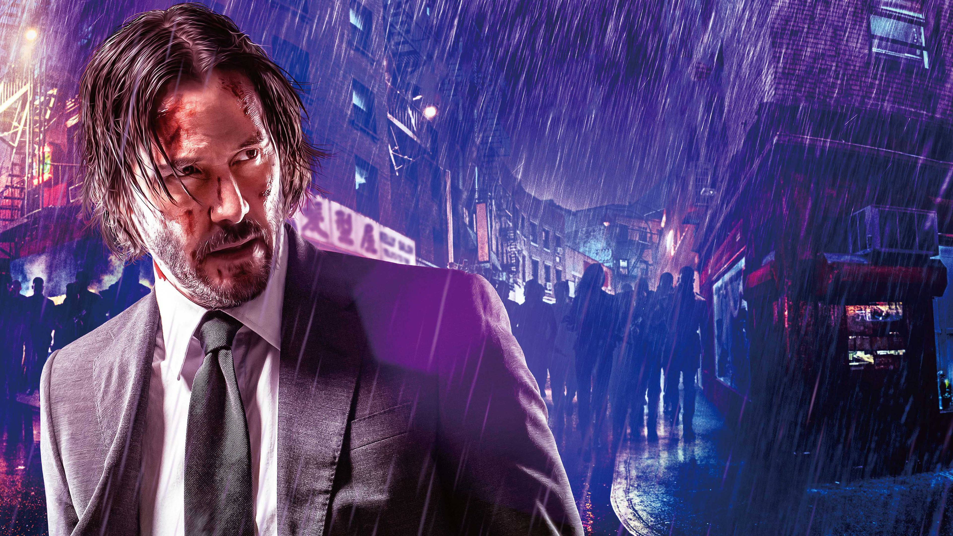 John Wick 桌布 壁紙 — 一個血跡斑斑、身穿西裝的男人在夜晚霓虹燈閃爍的都市街道上，透過傾盆大雨凝視著。