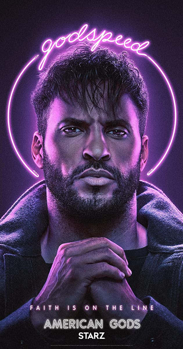 American Gods 桌布 壁紙 — 一個表情嚴肅的男人被一個發光的紫色霓虹光環框住，上方有「godspeed」這個詞。