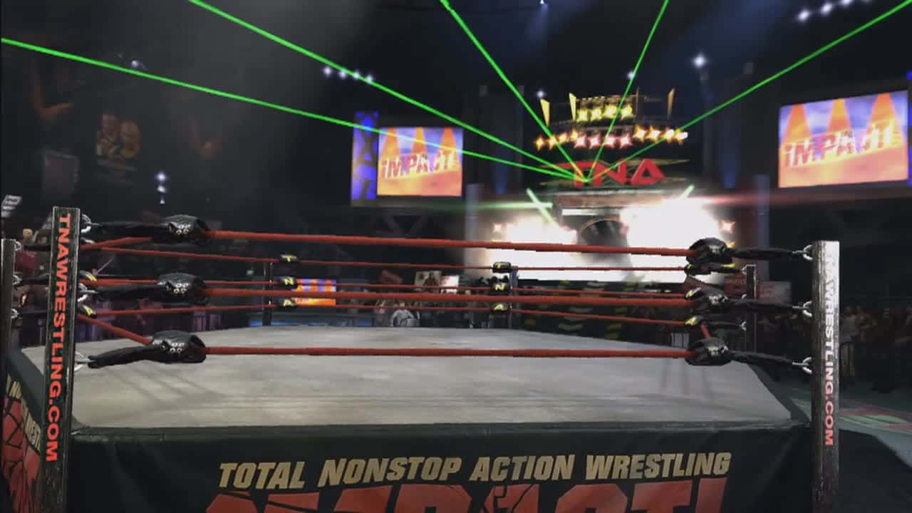 Wrestling Ring 桌布 壁紙 — 一個被綠色雷射和明亮舞台燈光照亮的TNA摔角擂台，背景有「IMPACT」螢幕。