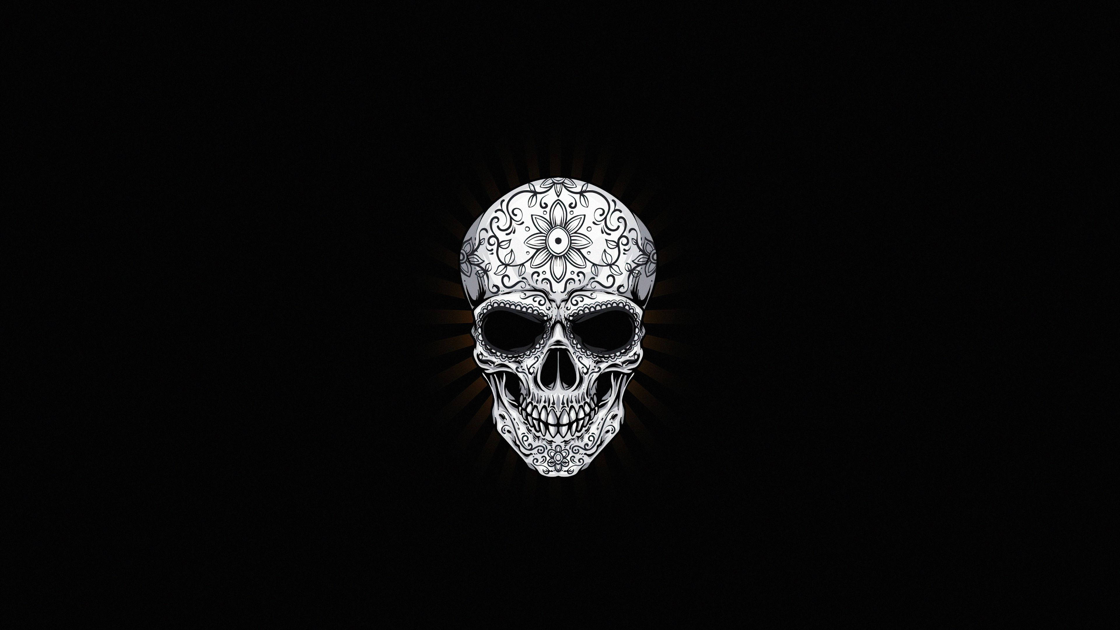 Black Skull 桌布 壁紙 — 一個裝飾精緻的糖骷髏在純黑背景下散發出耀眼的光芒。
