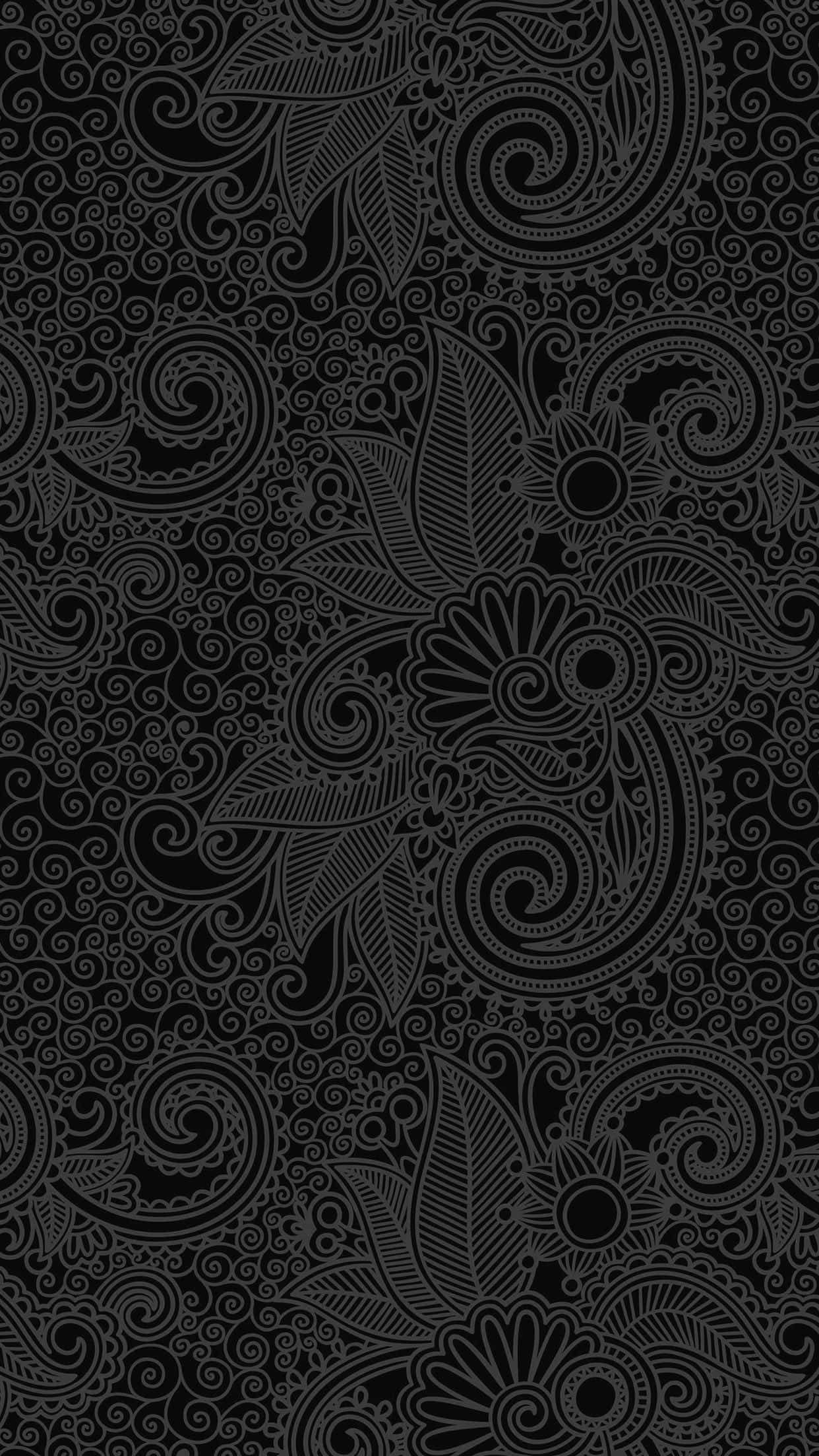 Paisley 桌布 壁紙 — 一個複雜的黑灰色佩斯利圖案，帶有漩渦花卉圖案和精細線條，在深色背景上。