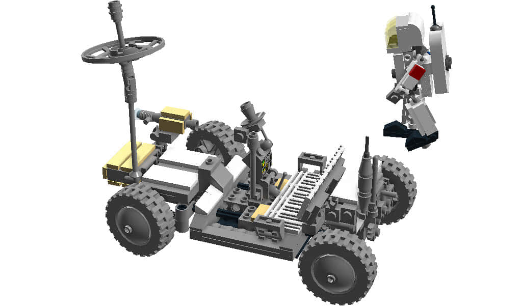 Lunar Rover 桌布 壁紙 — 一個詳細的LEGO模型，展示了一輛堅固的越野車，配有方向盤和一個小型機器人公仔在旁邊。