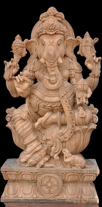 Hindu God 桌布 壁紙 — 一個詳細的石雕，描繪印度教神祇象頭神伽內什，有四隻手臂和象頭，坐在裝飾華麗的基座上。