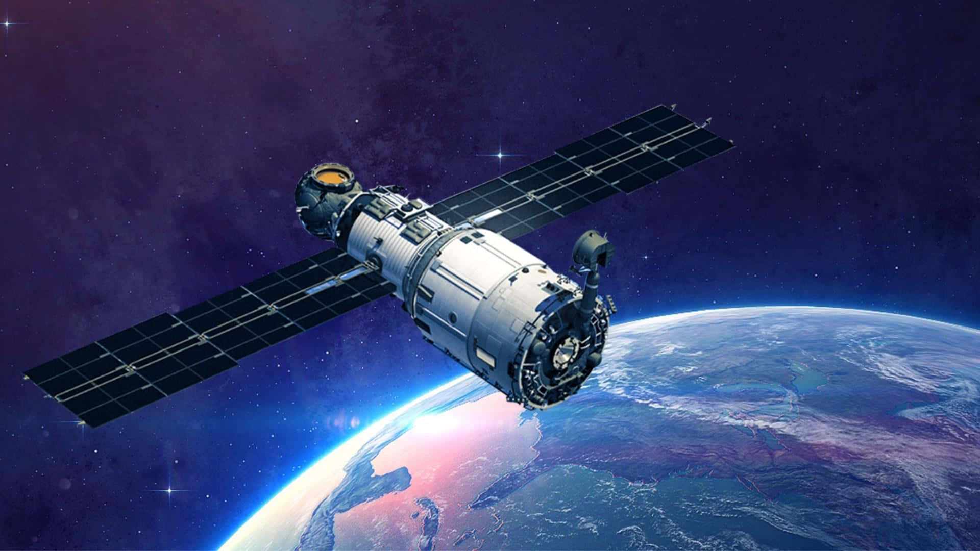 衛星繞地球運行，帶有發光的極光和星空 — 外太空 GIF 壁紙