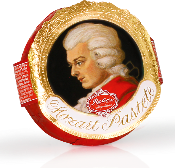 mozart 桌布 壁紙 — 一個豪華的莫扎特糕點罐，帶有金色華麗框架和莫扎特肖像，背景為黑色。