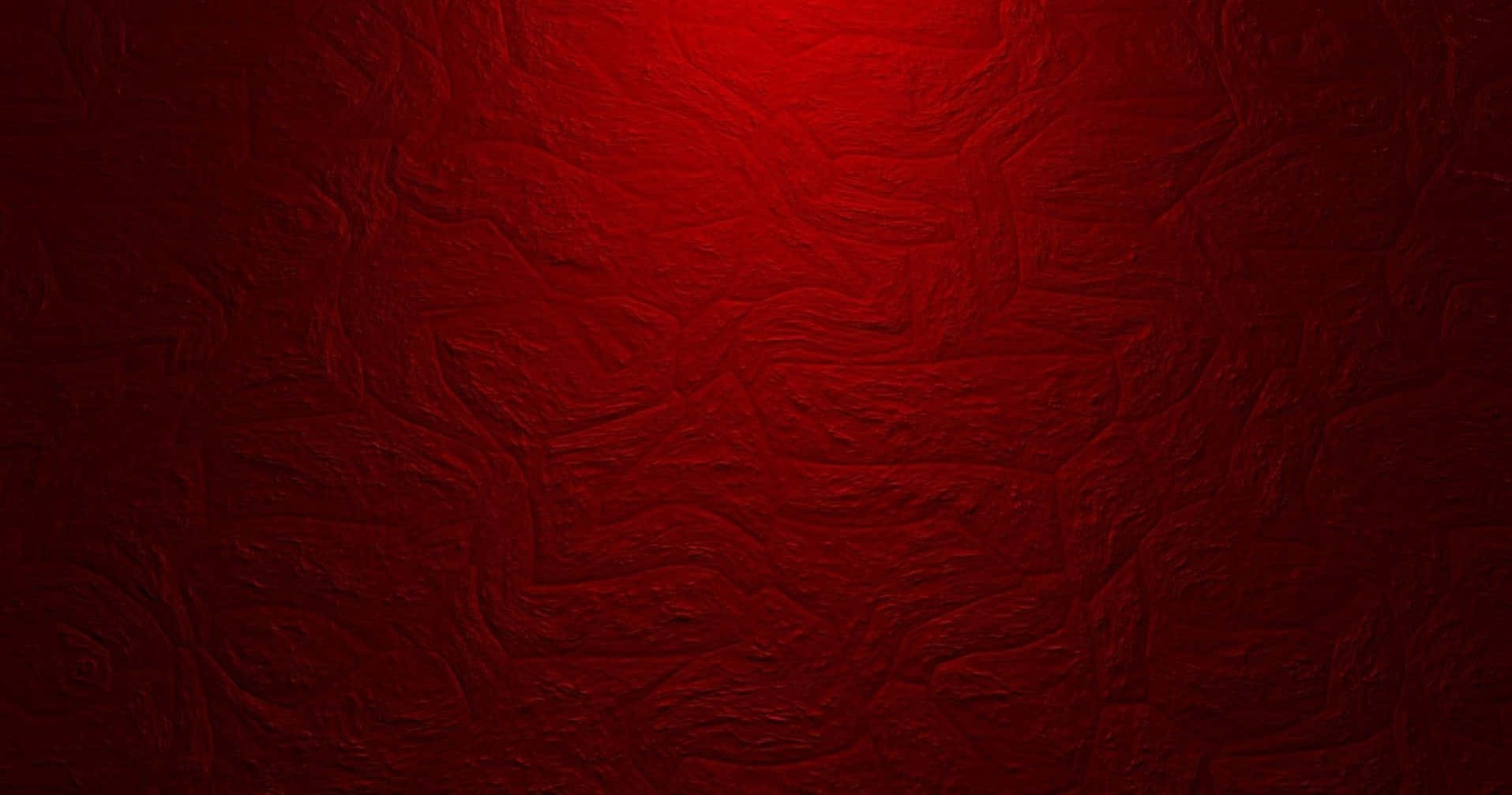 High Resolution Red 桌布 壁紙 — 一個質感豐富的紅色表面，帶有漩渦圖案和從中心到邊緣的發光漸變。