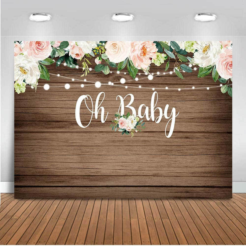Baby Shower 桌布 壁紙 — 一個質樸的木製背景，點綴著粉紅色和白色的花卉、燈串以及草書文字 Oh Baby，適合嬰兒派對照片。