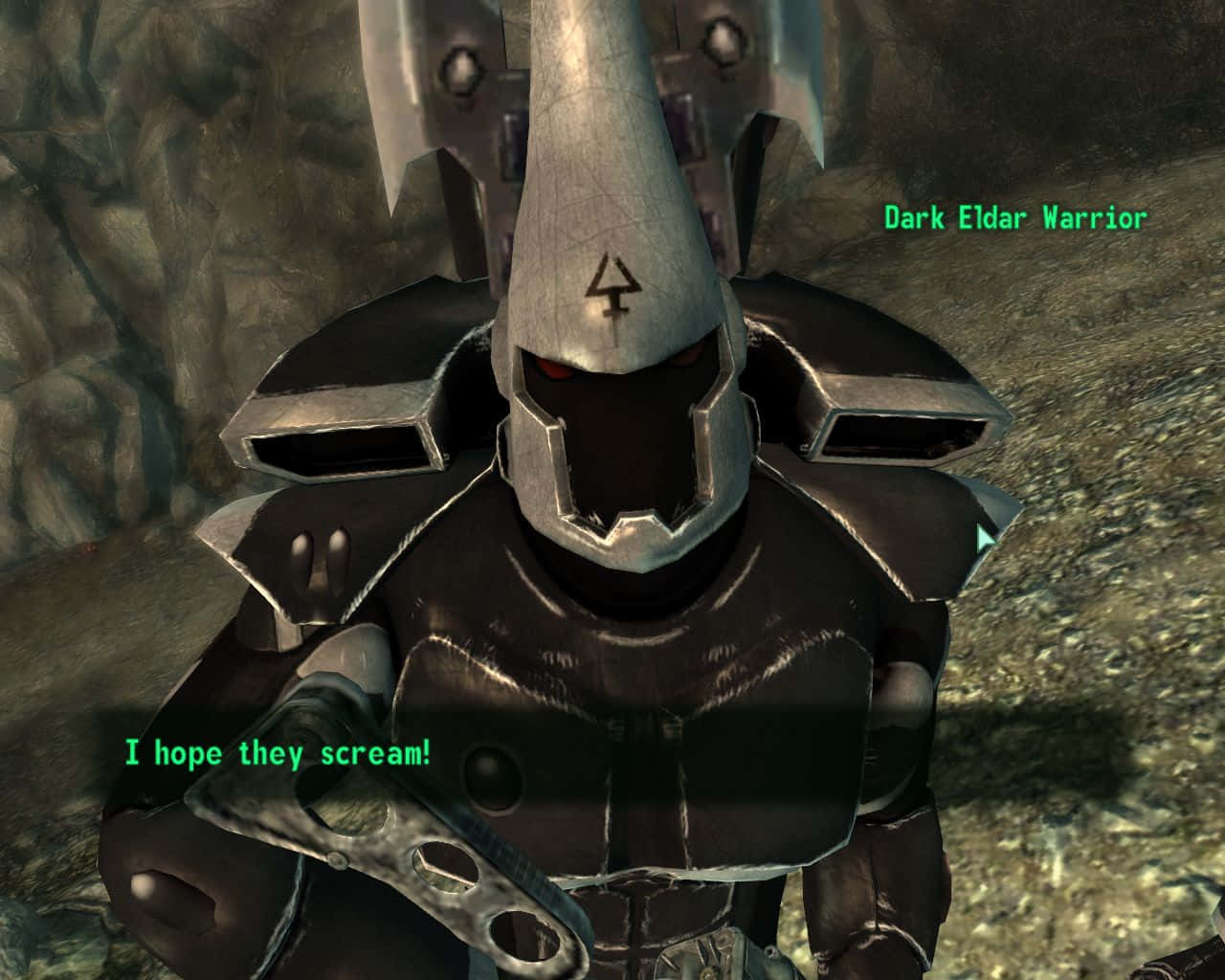 Fallout Enclave 桌布 壁紙 — 一個身穿暗色盔甲、眼睛發出紅光的兇猛黑暗靈族戰士站在岩石洞穴環境中。