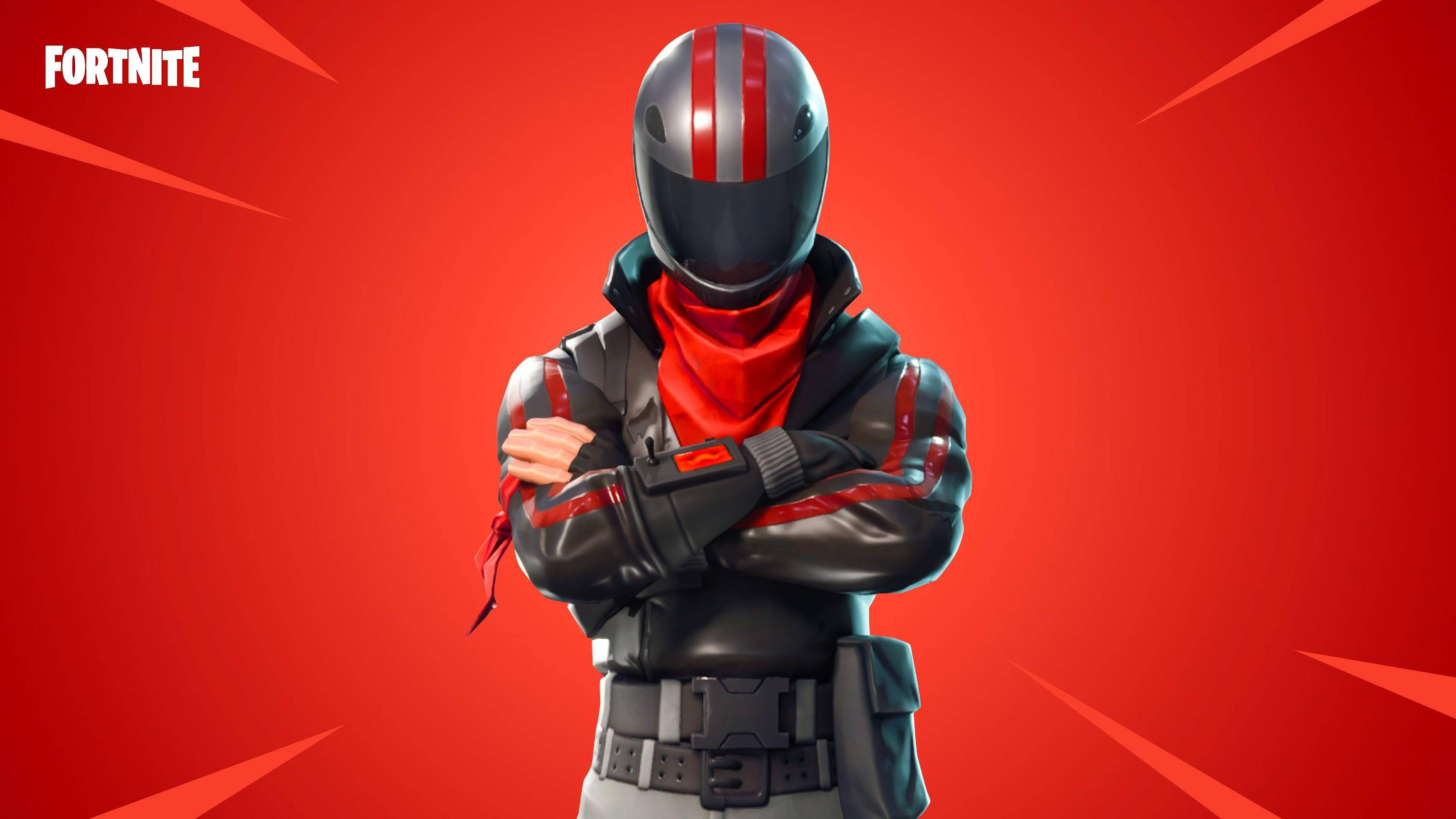 Fortnite 造型 桌布 壁紙 — 一個身穿黑色和紅色裝備的Fortnite角色自信地交叉雙臂，站在帶有動態對角線的醒目紅色背景前。