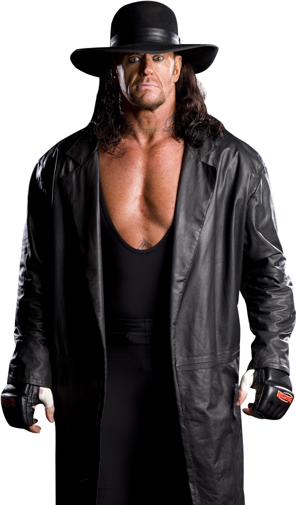 Undertaker 桌布 壁紙 — 一個身穿黑色皮風衣和寬邊帽的威脅性摔角手，在黑暗背景下強烈凝視。