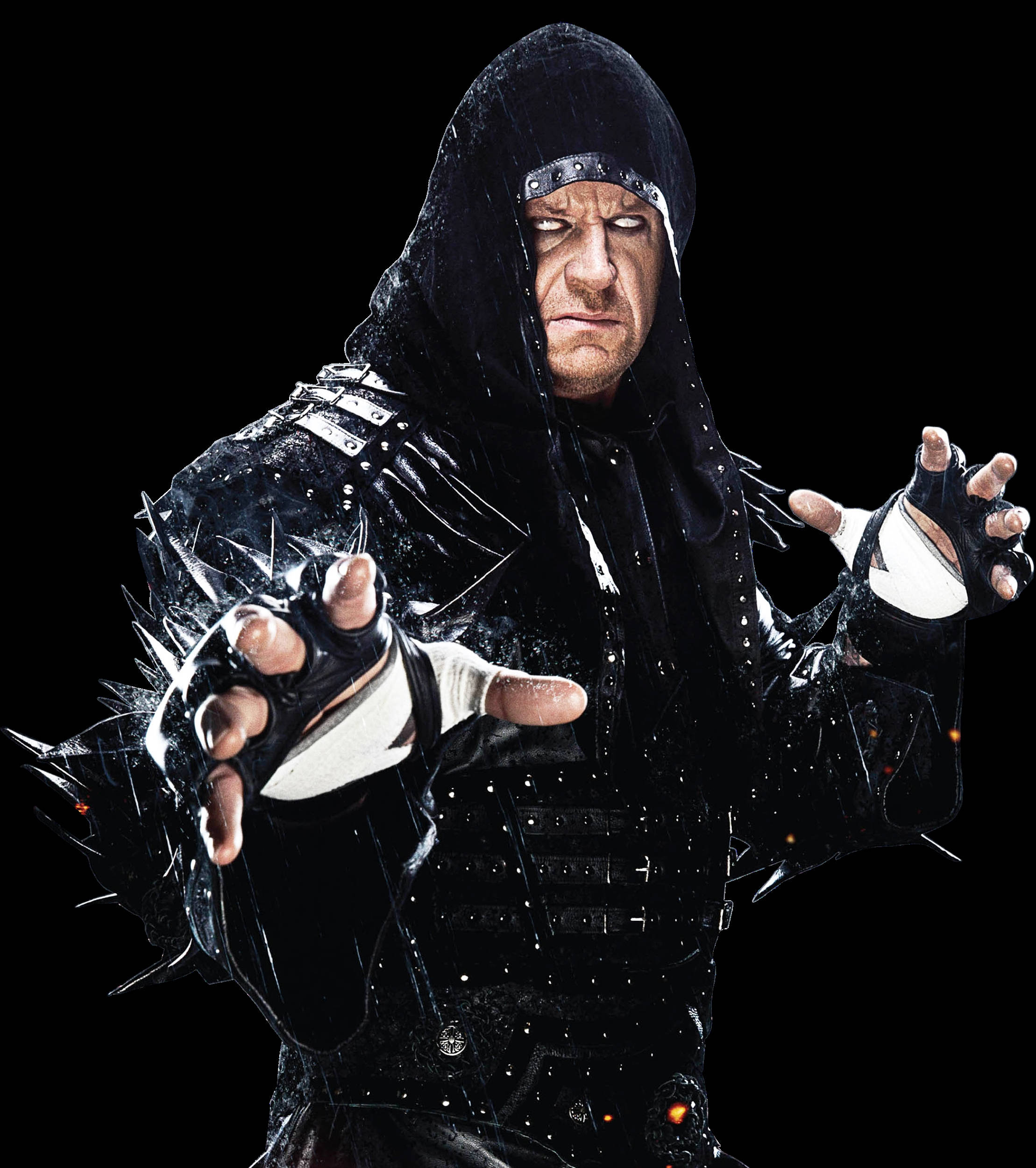 Undertaker 桌布 壁紙 — 一個身穿黑色連帽服裝、戴著尖刺手套、眼睛發光的兇猛摔角手，在黑暗背景下凝視著。