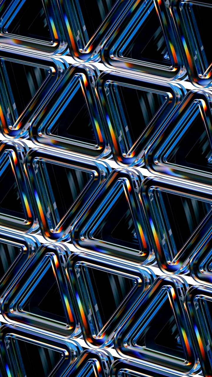 閃亮金屬三角形的抽象幾何圖案，帶有彩虹反射。 — 3D iPhone 壁紙 壁紙