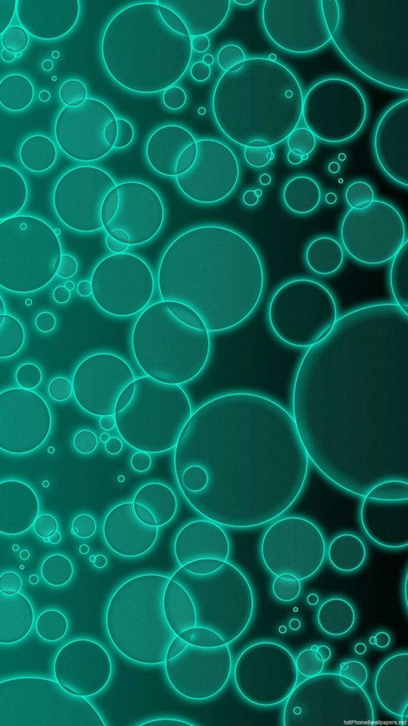 Bubbles 桌布 壁紙 — 一個迷人的圖案，發光的青綠色圓圈漂浮在深色漸變背景上。