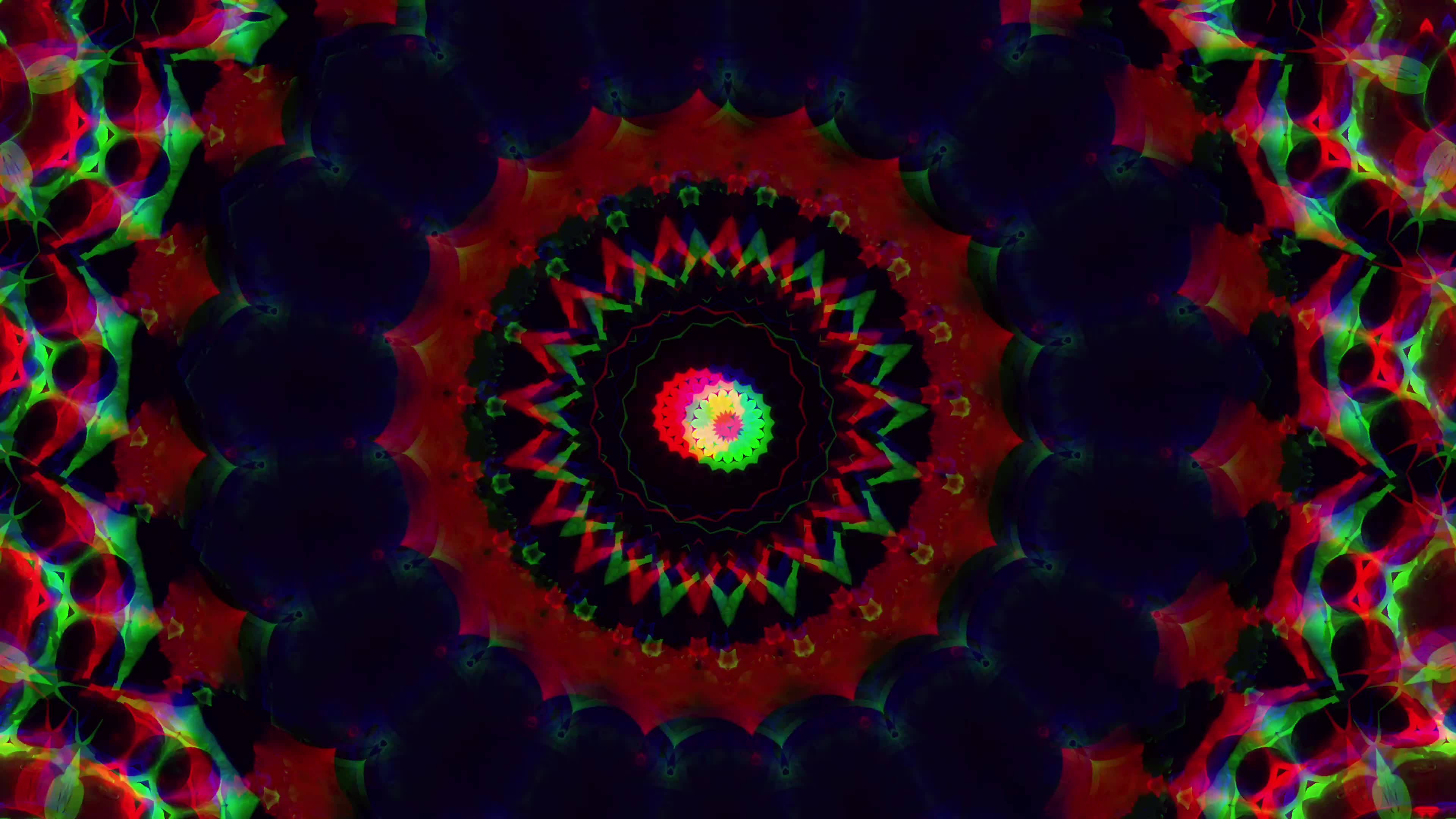 chakra 桌布 壁紙 — 一個迷人的數位曼陀羅，帶有從發光中心輻射出的鮮豔紅、綠、黑色碎形圖案。
