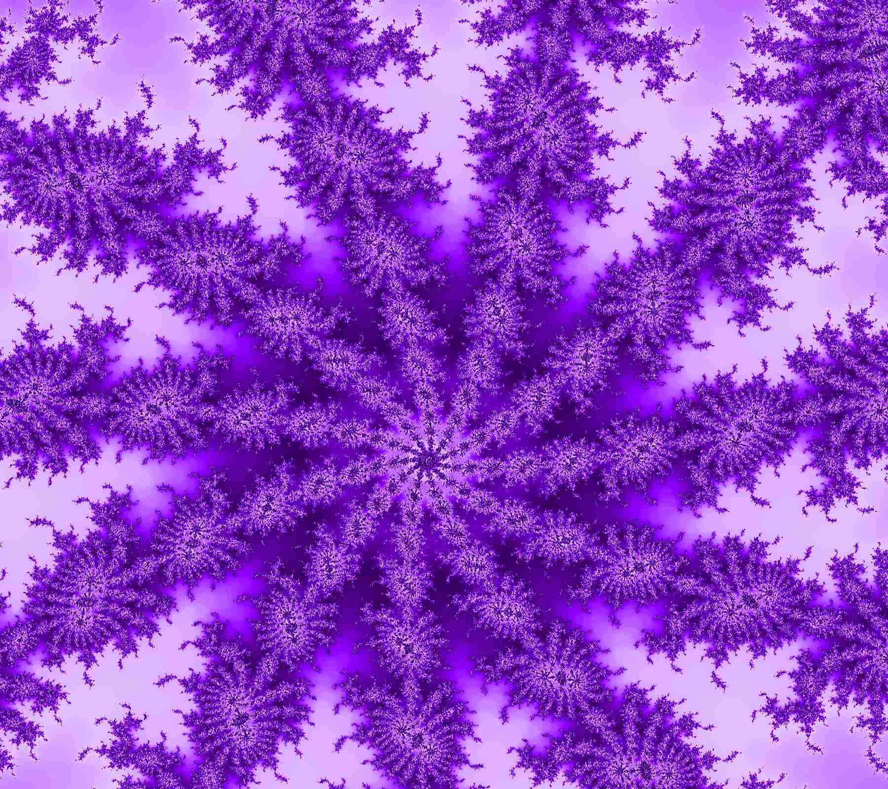 Purple Dye 桌布 壁紙 — 一個迷人的紫色碎形圖案，在柔和的薰衣草背景上以對稱的星爆設計向外輻射。