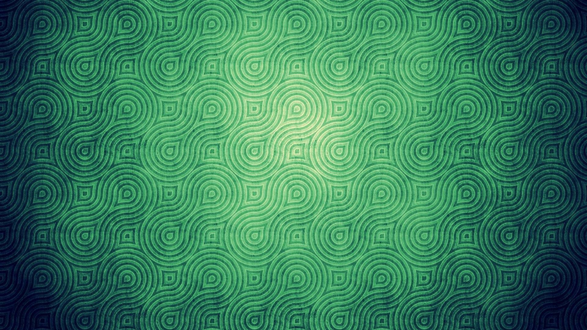 復古 桌布 壁紙 — 一個迷人的綠色漸變壁紙，帶有重複的同心圓圖案，從明亮的中心向外輻射。