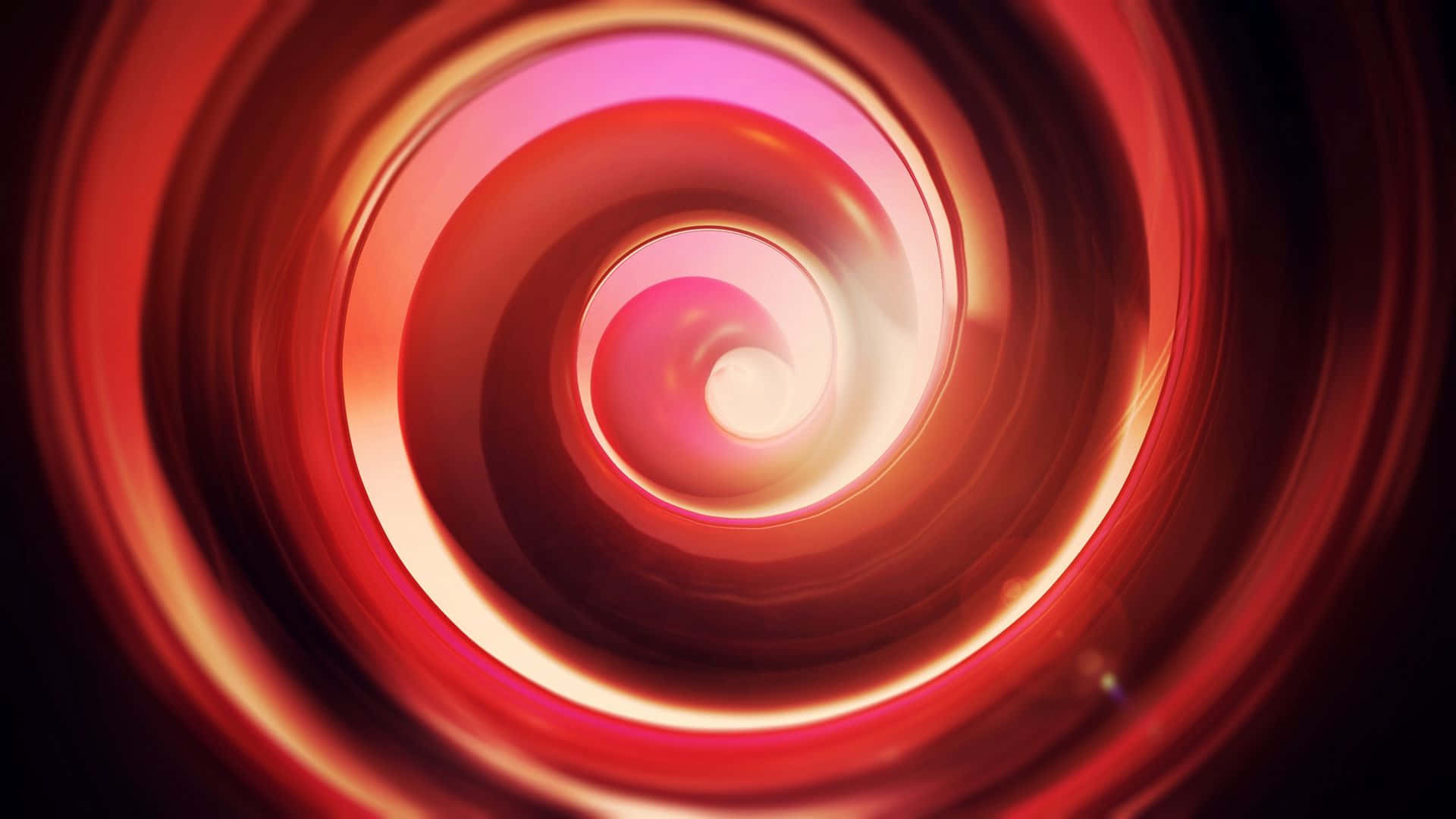 1920x1080 Red 桌布 壁紙 — 一個迷人的螺旋隧道，由發光的紅色和粉紅色光線組成，逐漸退入明亮的白色中心。