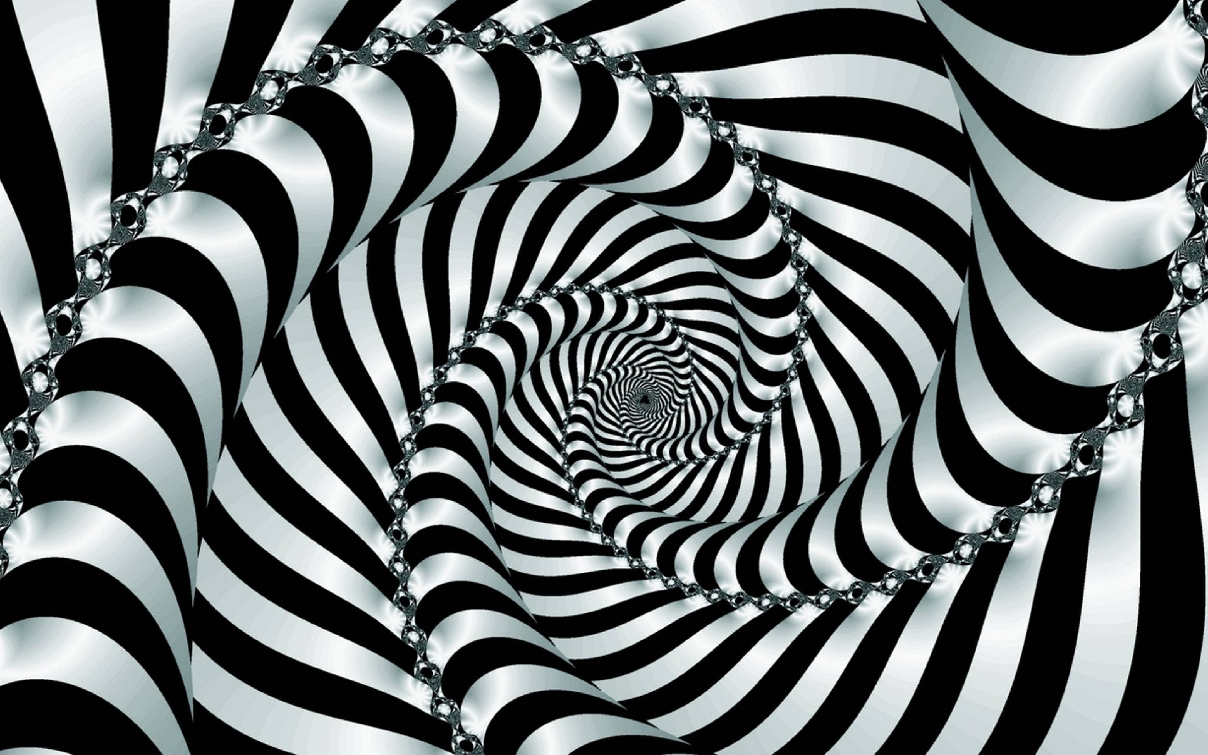 Spiral 桌布 壁紙 — 一個迷人的黑白螺旋隧道，閃亮的金屬鏈條纏繞在其催眠般的條紋中。