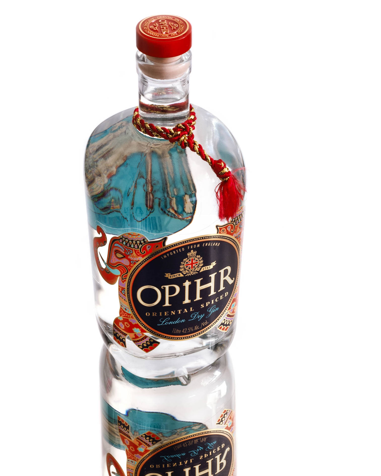 Opihr琴酒瓶，紅色瓶蓋和藍色標籤，在白色表面上反射。 — Juice Wrld 壁紙