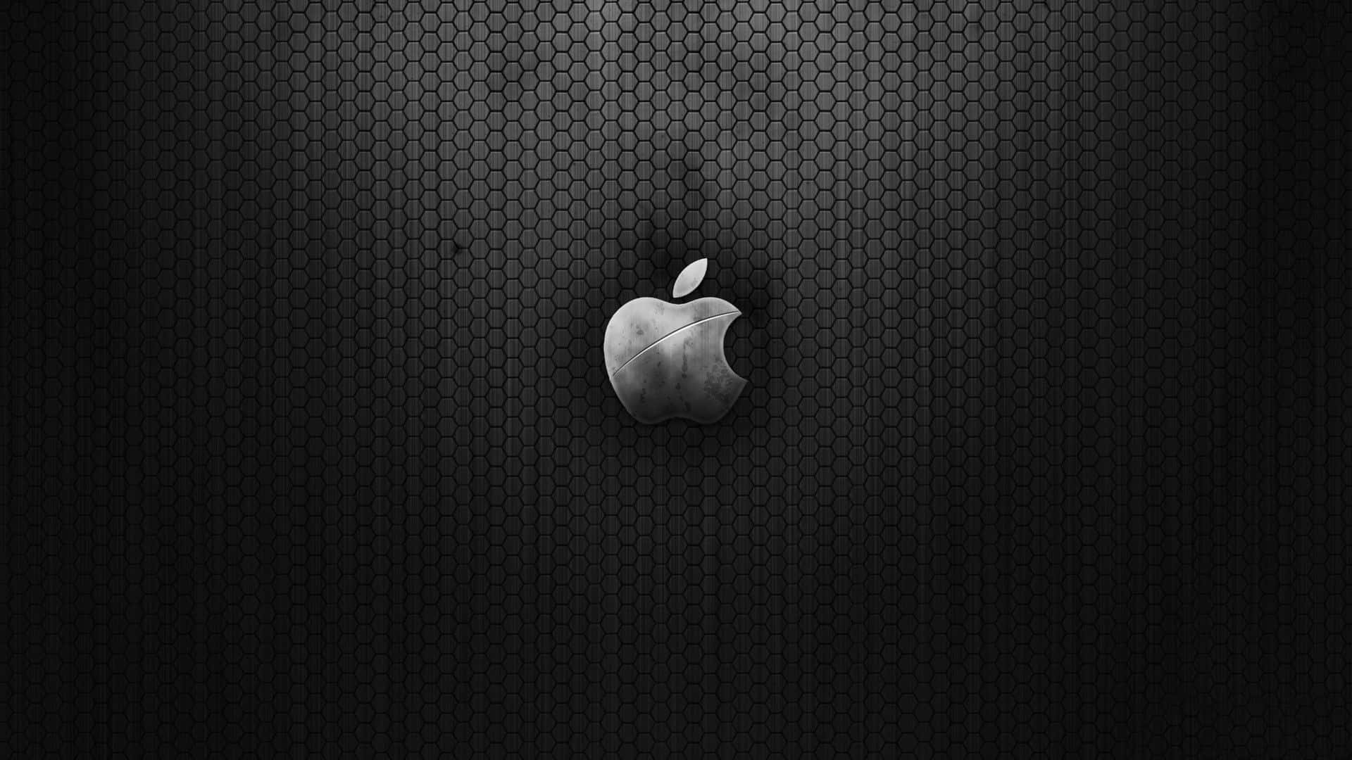 六邊形 桌布 壁紙 — 一個金屬質感的Apple標誌置中於深色六角形網格背景上，帶有微妙照明。