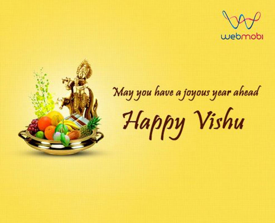 Vishu 桌布 壁紙 — 一個金色Vishu Kani托盤，裝滿色彩繽紛的水果和神像，背景為明亮的黃色紋理背景，並帶有節日文字。