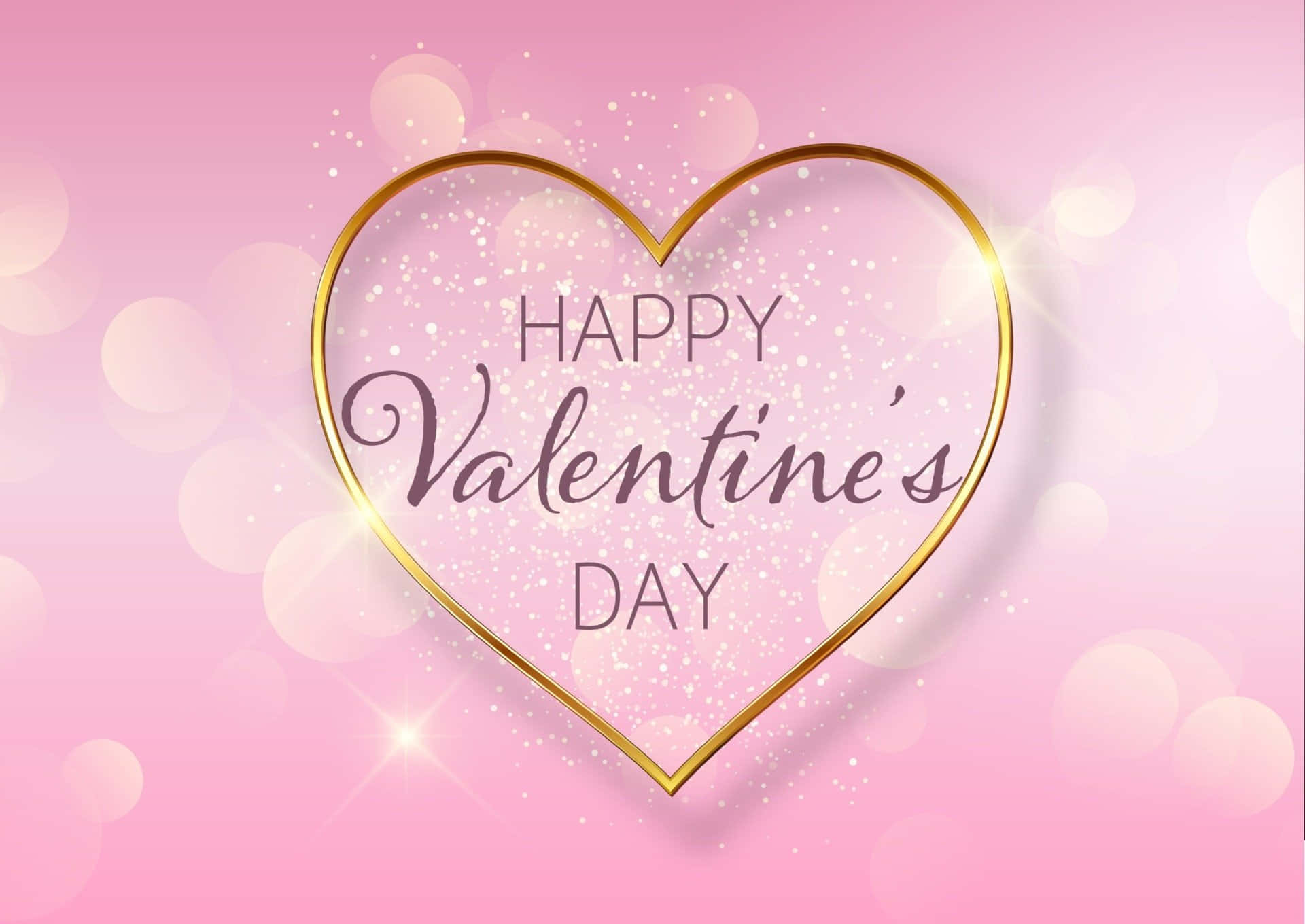 happy valentine's day 桌布 壁紙 — 一個金色心形，閃爍著閃光，並帶有「Happy Valentine's Day」文字，漂浮在柔和的粉紅色散景背景上。