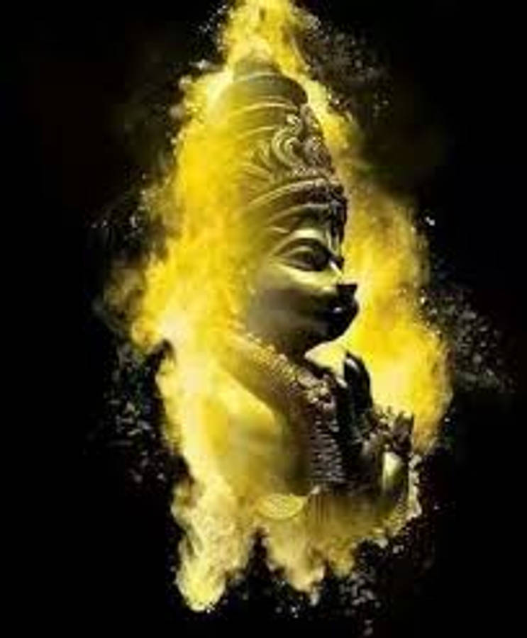 Hanuman 桌布 壁紙 — 一個金色的神聖形象從爆炸性的黃色粉末中浮現，背景是純黑色。