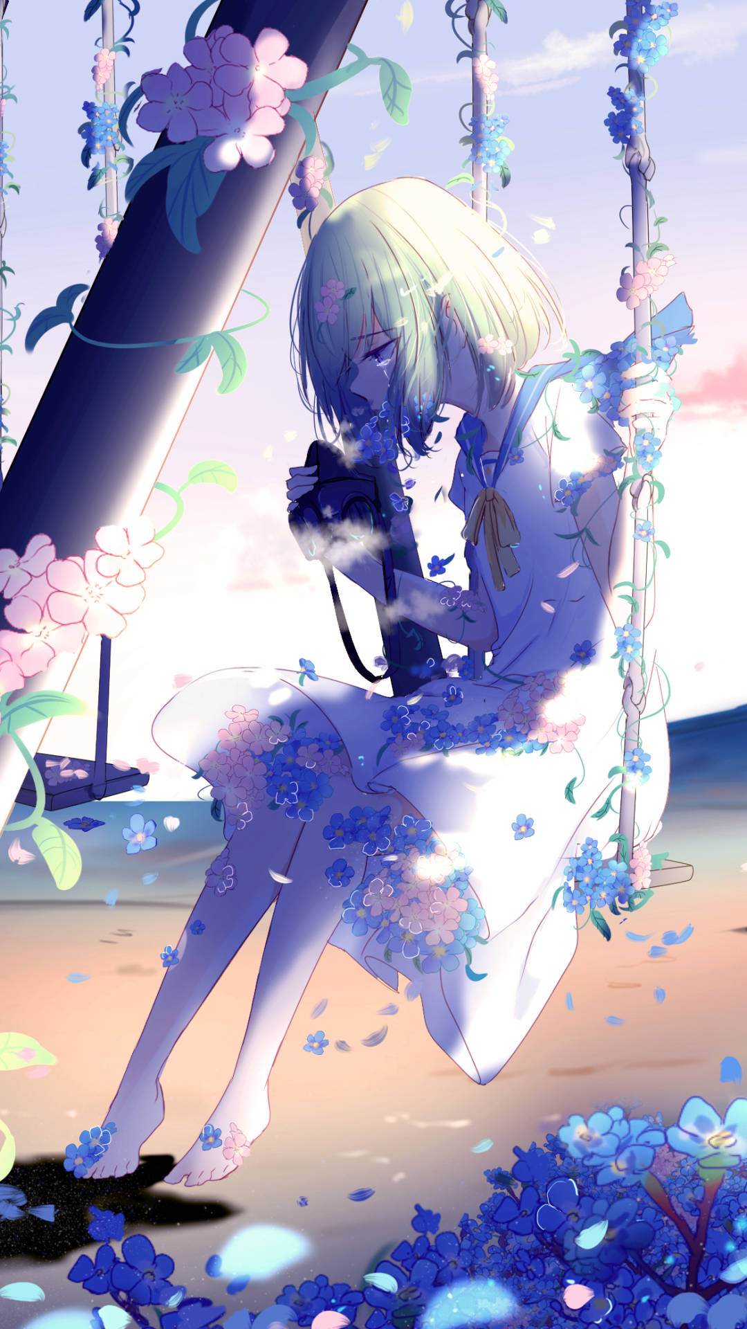 Sad Anime Phone 桌布 壁紙 — 一個金髮動漫女孩坐在鞦韆上，周圍飄落著藍色和粉紅色的花朵，背景是柔和的粉彩天空。