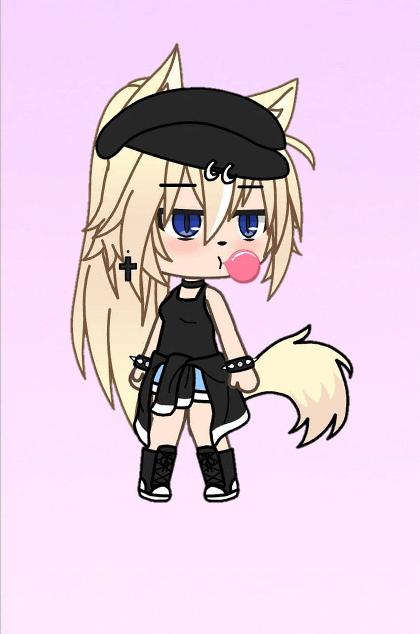 Cute Tomboy 桌布 壁紙 — 一個金髮狐狸耳朵的chibi動漫女孩，在柔和粉紅色背景前吹泡泡糖，戴著黑色貝雷帽和衣服。