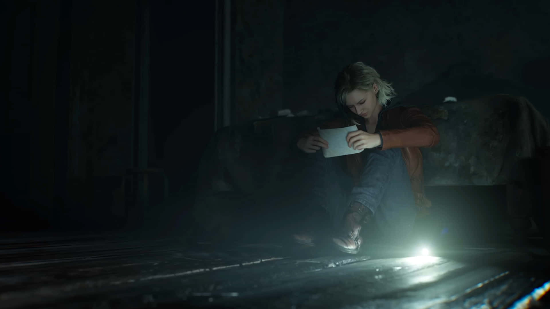 Resident Evil Requiem Grace Ashcroft 壁紙 — 一個金髮的人坐在昏暗房間的黑暗地板上，手持發光裝置。