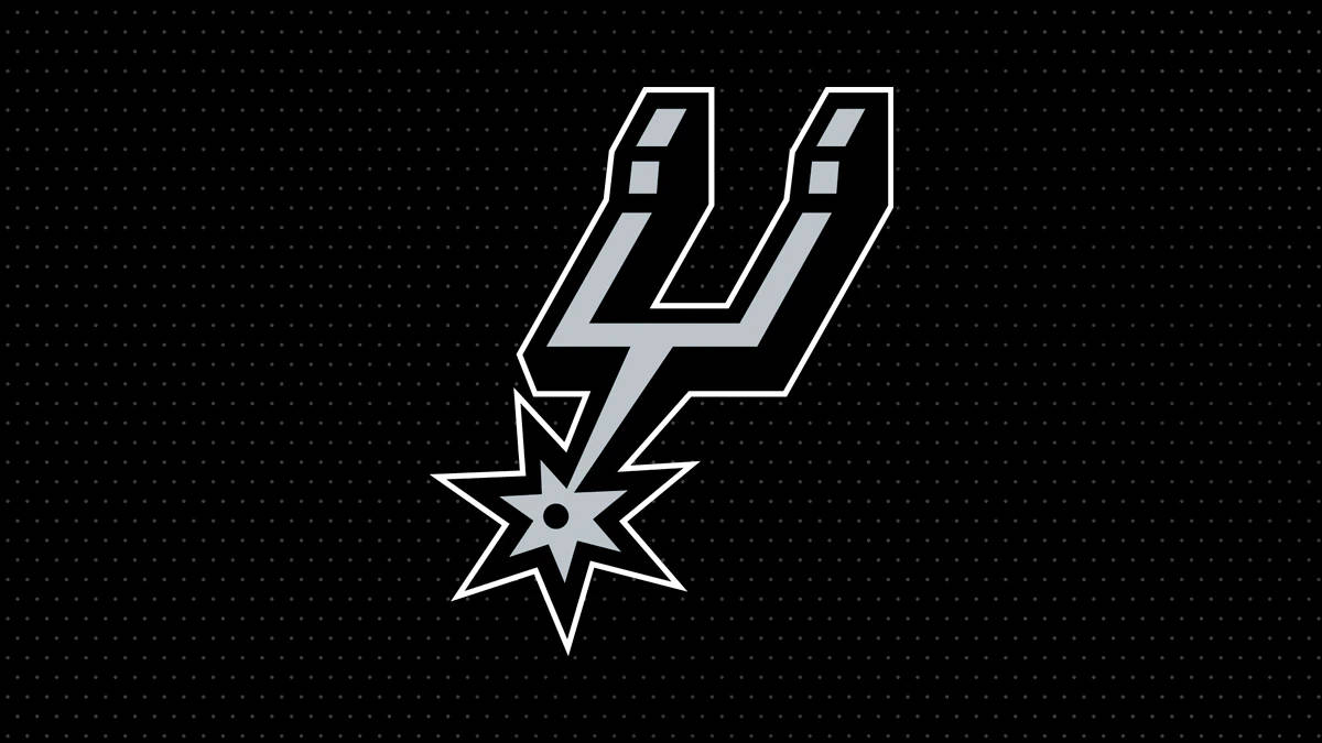Spurs 桌布 壁紙 — 一個銀色的聖安東尼奧馬刺隊標誌，帶有星爆設計，在黑色背景上帶有微妙的點點圖案，非常突出。