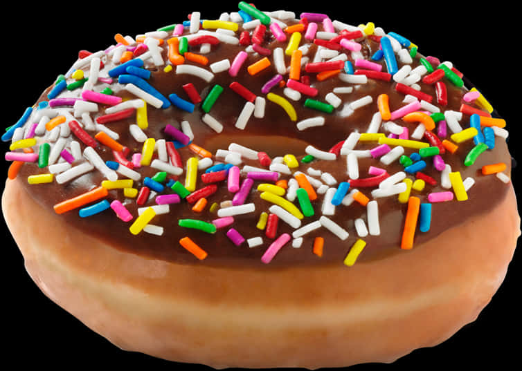 Sprinkles 桌布 壁紙 — 一個閃亮的巧克力糖霜甜甜圈，上面鋪滿鮮豔的彩虹糖針，襯托在純黑背景上。