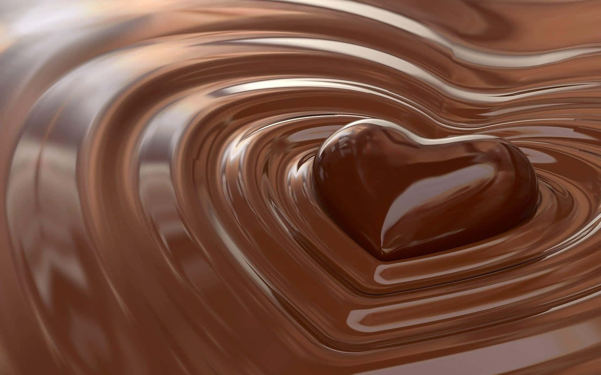 Chocolate 桌布 壁紙 — 一個閃亮的心形巧克力放在旋轉的融化巧克力中，形成同心漣漪。