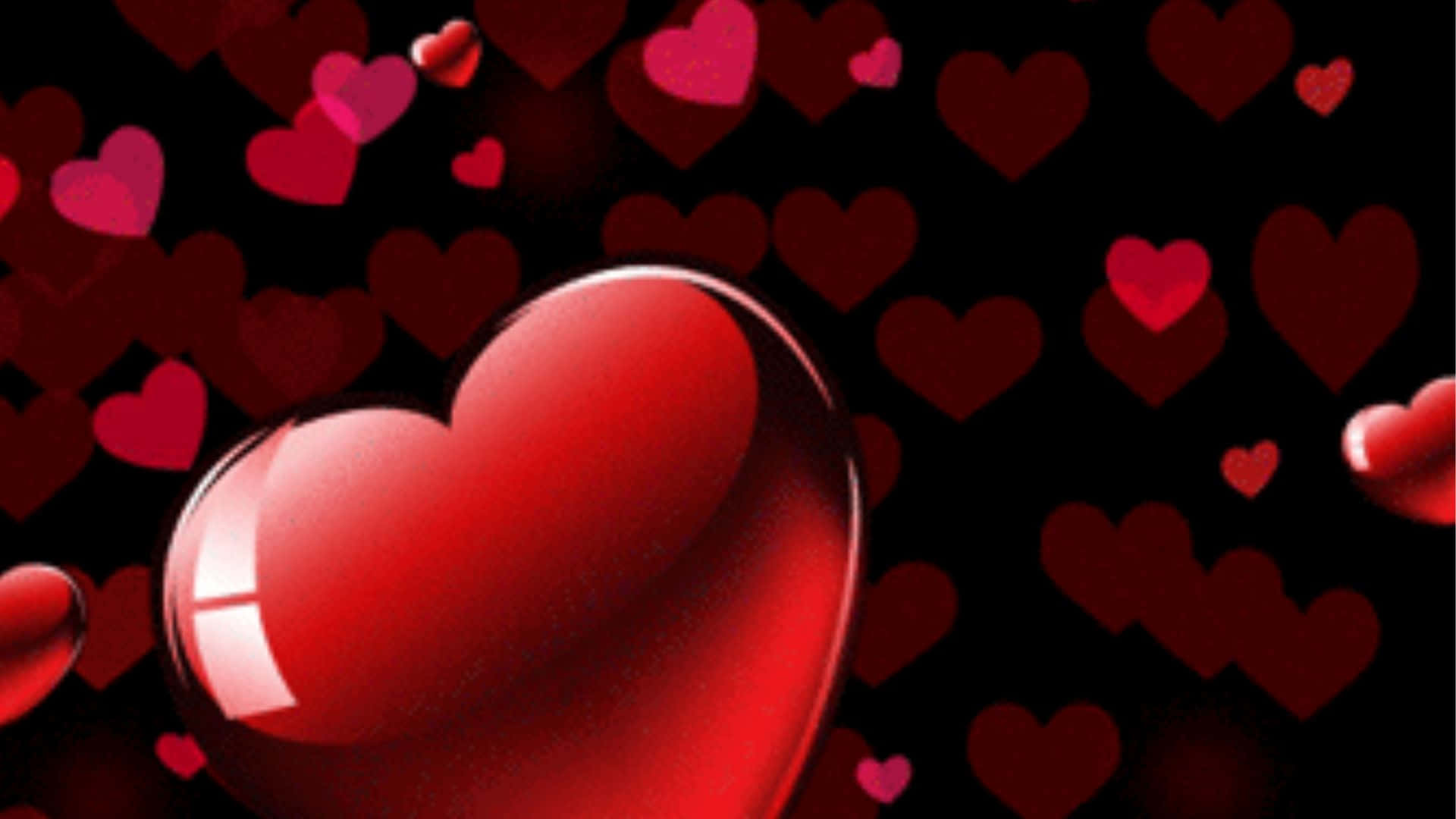 Red Hearts 桌布 壁紙 — 一個閃亮的紅色心形漂浮在黑暗背景上發光的心形之中。