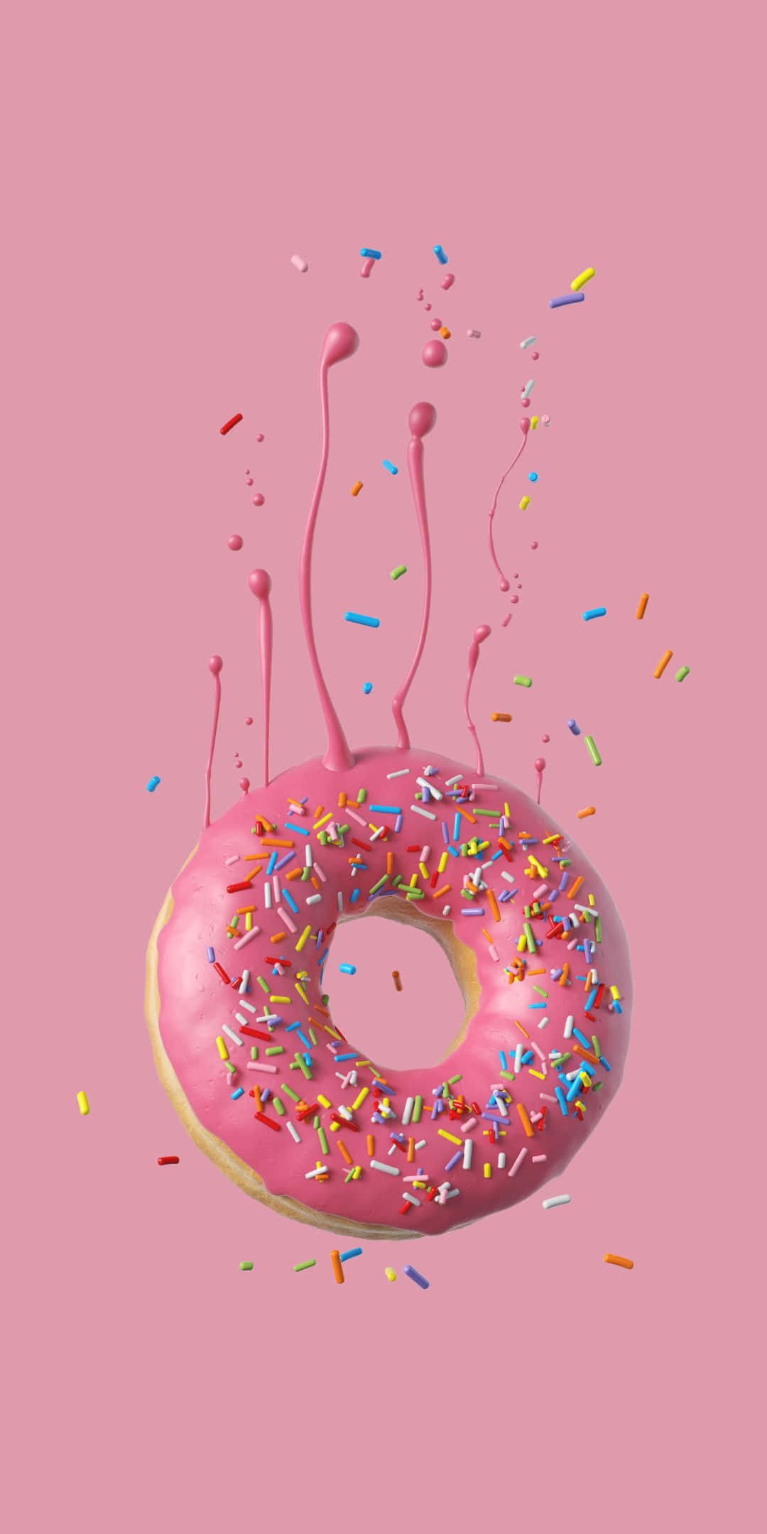 Sprinkles 桌布 壁紙 — 一個閃亮粉紅色糖霜甜甜圈，上面有彩色糖粒，在柔和的粉紅色背景上爆出滴落的糖霜。