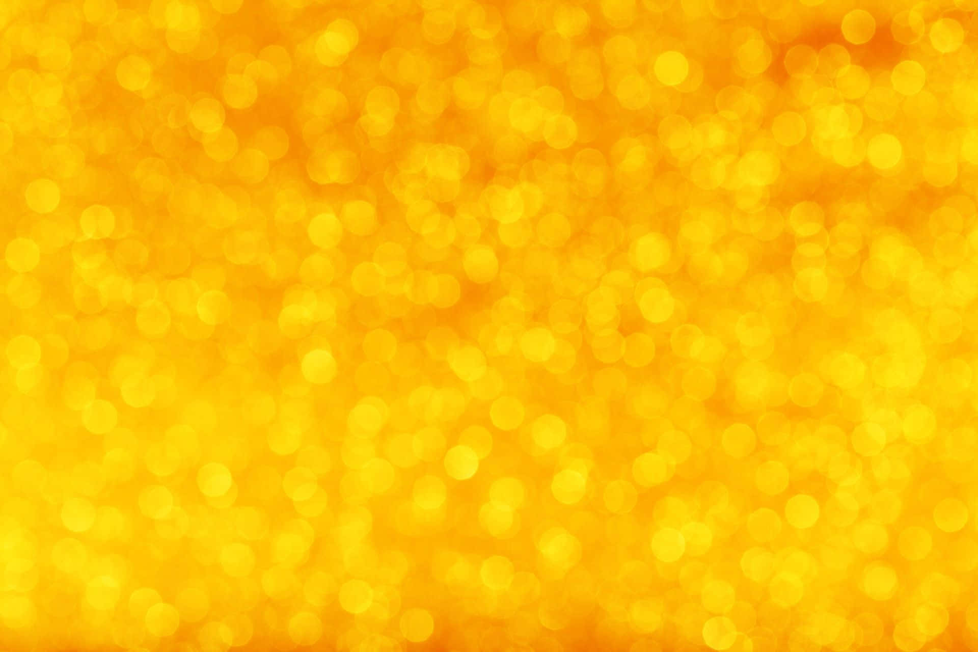 shiny 桌布 壁紙 — 一個閃耀的金色散景背景，柔和發光的圓圈營造出溫暖的節日氣氛。