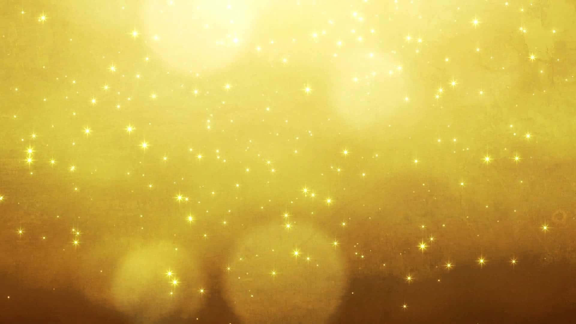 High Resolution Gold 桌布 壁紙 — 一個閃耀的金色背景，充滿閃爍的星星和柔和發光的散景燈光。