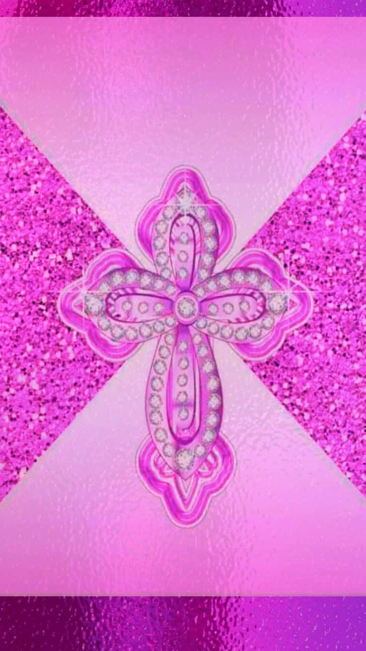Pink Cross 桌布 壁紙 — 一個閃閃發光的粉紅色十字架，鑲有鑽石，置於光芒四射的粉紅色漸變背景中央。