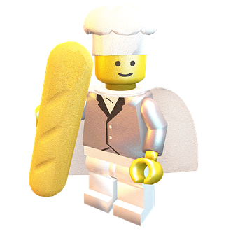 樂高 桌布 壁紙 — 一個開心的LEGO廚師迷你人偶在純白色背景前自豪地拿著一條長長的金色法式長棍麵包。