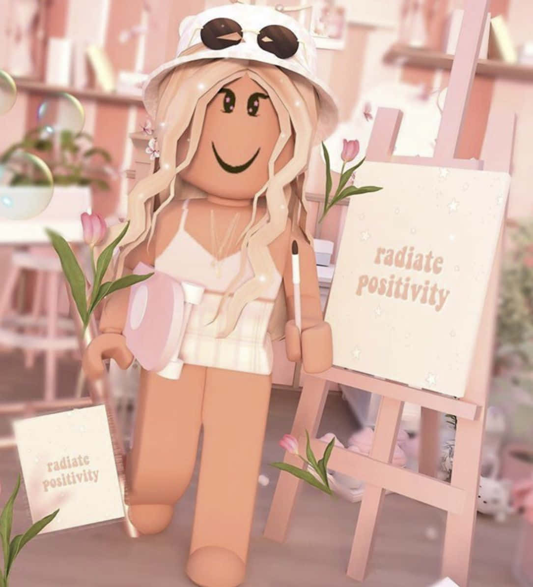 美學 Roblox 女孩 桌布 壁紙 — 一個開心的Roblox頭像，金髮戴太陽眼鏡，在粉紅色房間裡微笑站在展示「radiate positivity」的畫架旁。