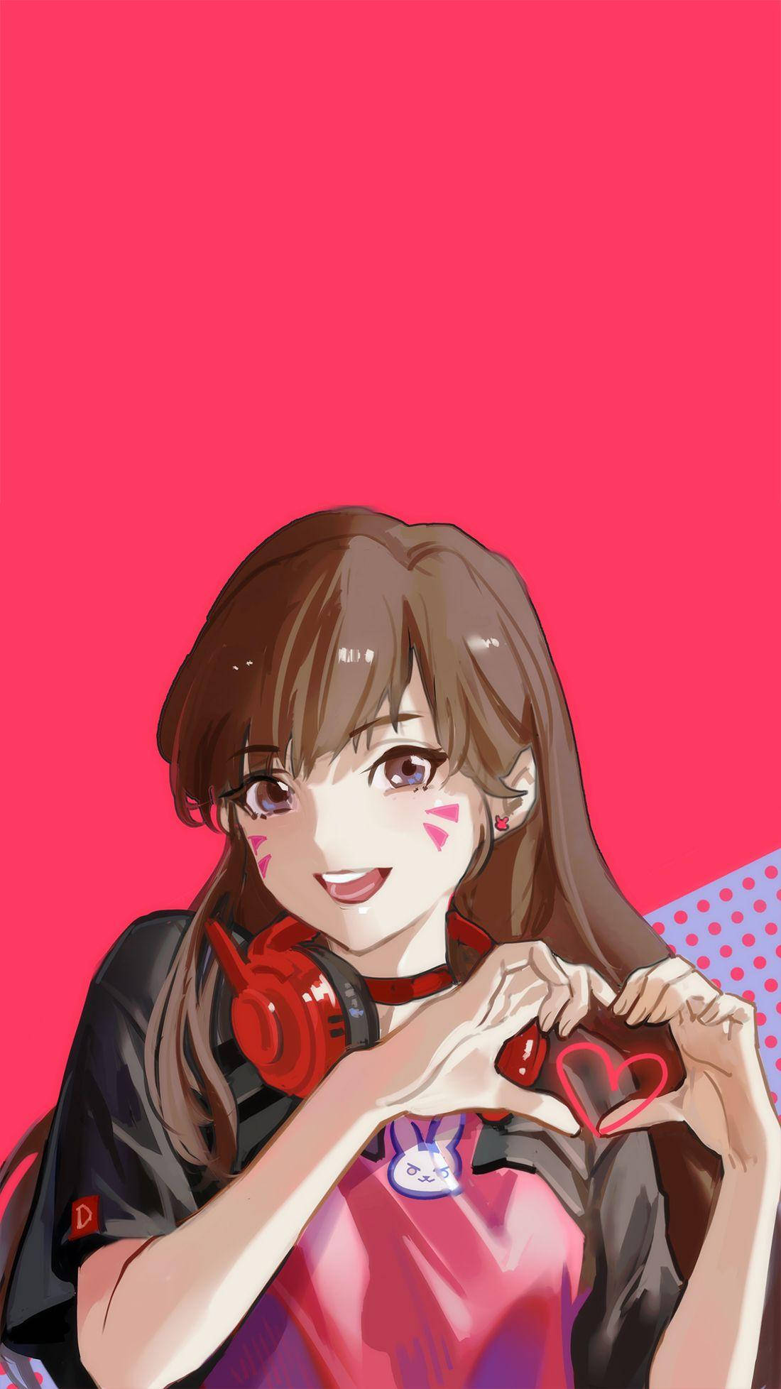 鬥陣特攻 桌布 壁紙 — 一個開心的動漫女孩，棕色頭髮，戴著紅色耳機，在充滿活力的粉紅色背景前用手比出心形。