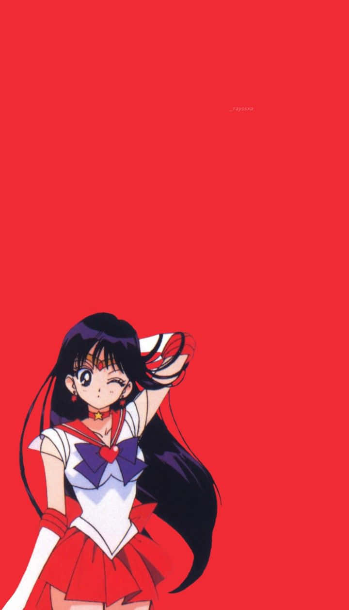 sailor mars 桌布 壁紙 — 一個開心的動漫女孩穿著紅白水手服，在純紅色背景前擺姿勢。