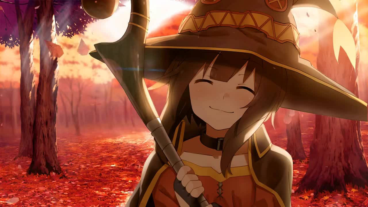 Megumin 桌布 壁紙 — 一個開心的動漫女巫，笑容滿面，在鋪滿火紅秋葉的森林地面上，手持法杖，背景是耀眼的夕陽。