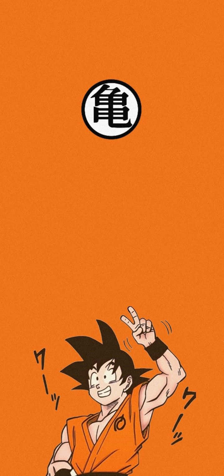 Goku 壁紙 — 一個開心的動畫男孩穿著橙色道服，在純橙色背景上的黑白烏龜符號下做出和平手勢。