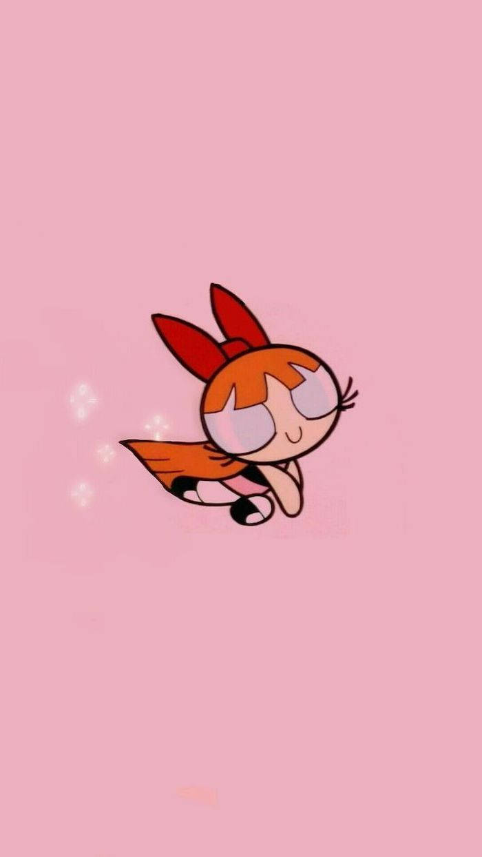 Powerpuff Girls 桌布 壁紙 — 一個開心的卡通女孩，橙色頭髮和紅色蝴蝶結，在柔和的粉紅色背景上輕輕漂浮，帶有閃光。