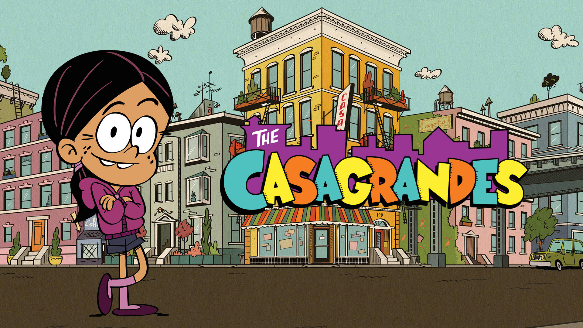 The Casagrandes 桌布 壁紙 — 一個開心的卡通女孩自豪地站在一棟色彩繽紛的城市建築前，上面有'The Casagrandes'標題。
