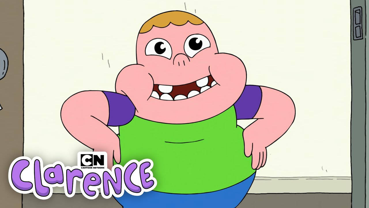 Animated 桌布 壁紙 — 一個開心的卡通男孩，咧嘴大笑，眼睛大大，自信地站在房間裡，穿著綠色襯衫和藍色褲子。