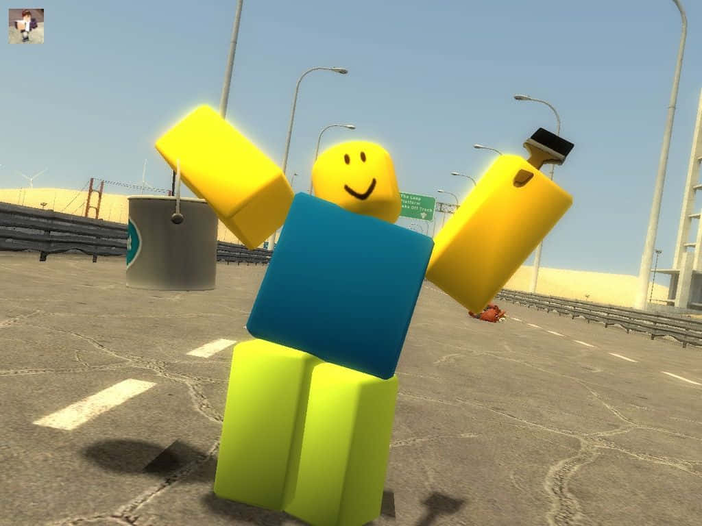 Roblox Noob 桌布 壁紙 — 一個開心的方塊形Roblox頭像，黃色手臂和藍色身軀，站在裂開的柏油路上，頭頂是晴朗的藍天。