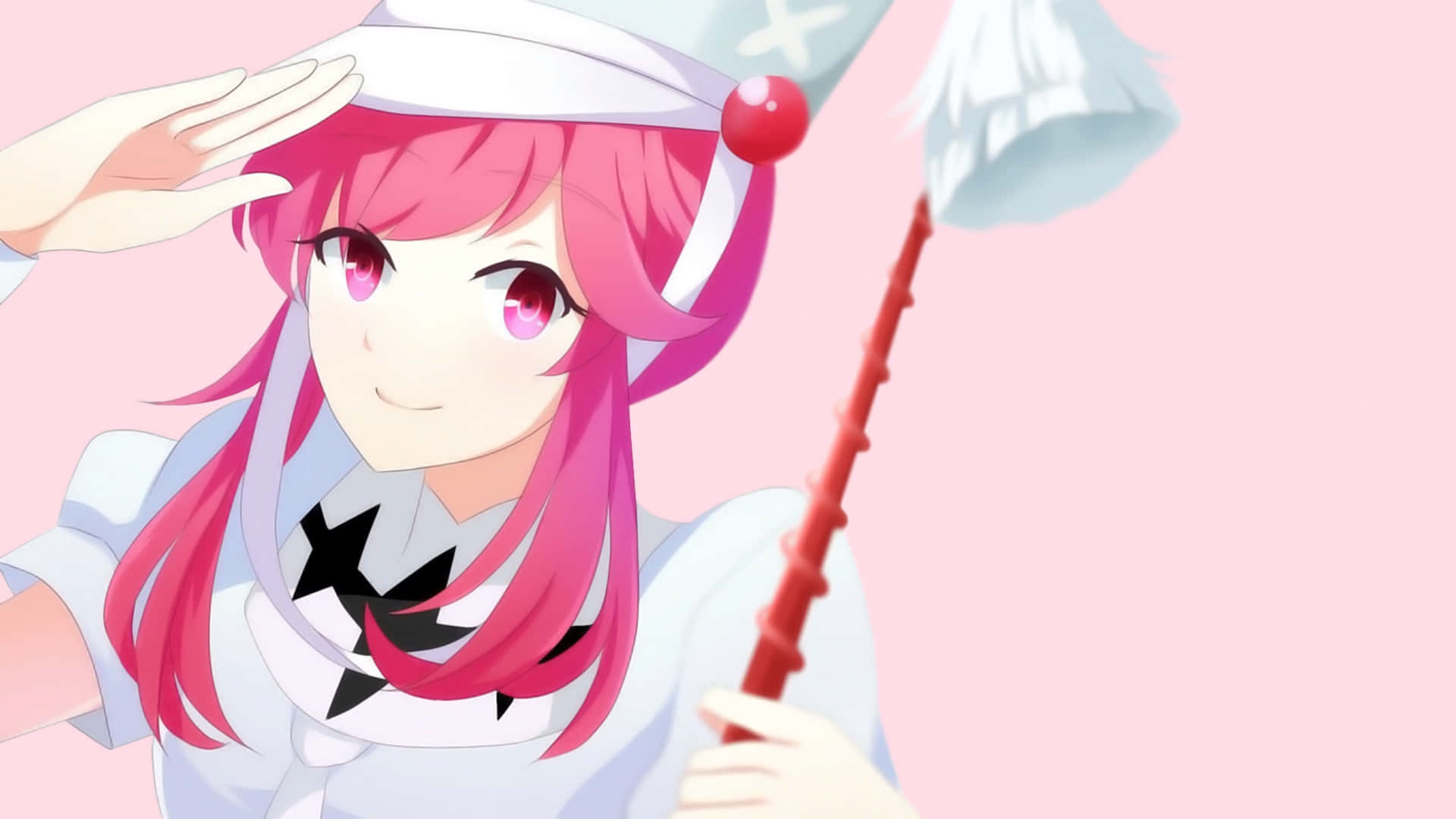 Nonon Jakuzure 桌布 壁紙 — 一個開心的粉紅色頭髮動漫女孩，在柔和的粉紅色背景前，拿著紅色魔杖敬禮。
