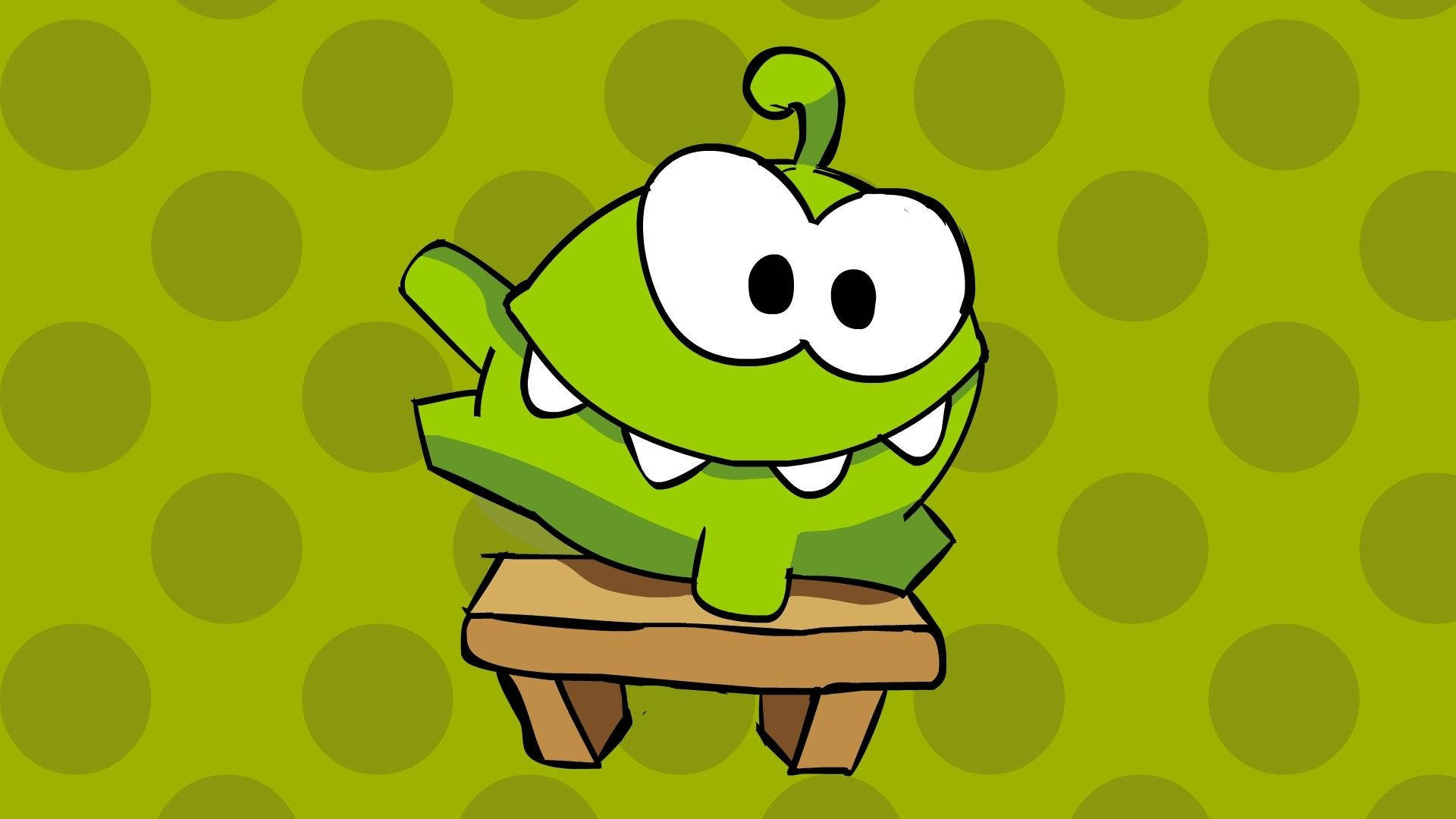 Kawaii Frog 桌布 壁紙 — 一個開心的綠色卡通角色，有大眼睛和尖牙齒，坐在木凳上，背景是橄欖色圓點。
